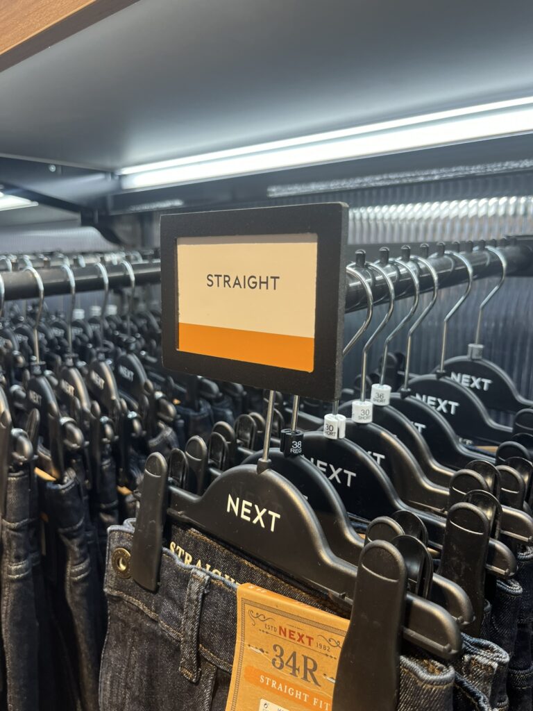 Landscape Foamex Custom Design Reflex Sign Holder Plastic Graphic Display Solution in Next PLC Fashion Retailer Menswear Department