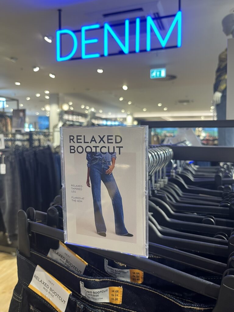 A6 Reflex Sign Holder Plastic Graphic Display Solution in New Look Fashion Retailer